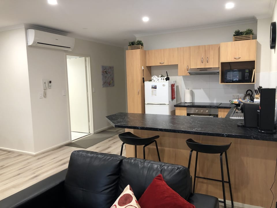 Modern well equipped kitchen with breakfast bar 
