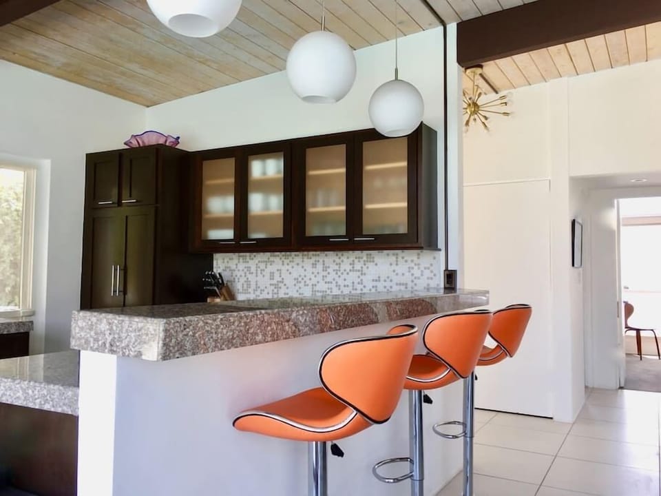 Seating in style, adjustable barstools for custom heights.