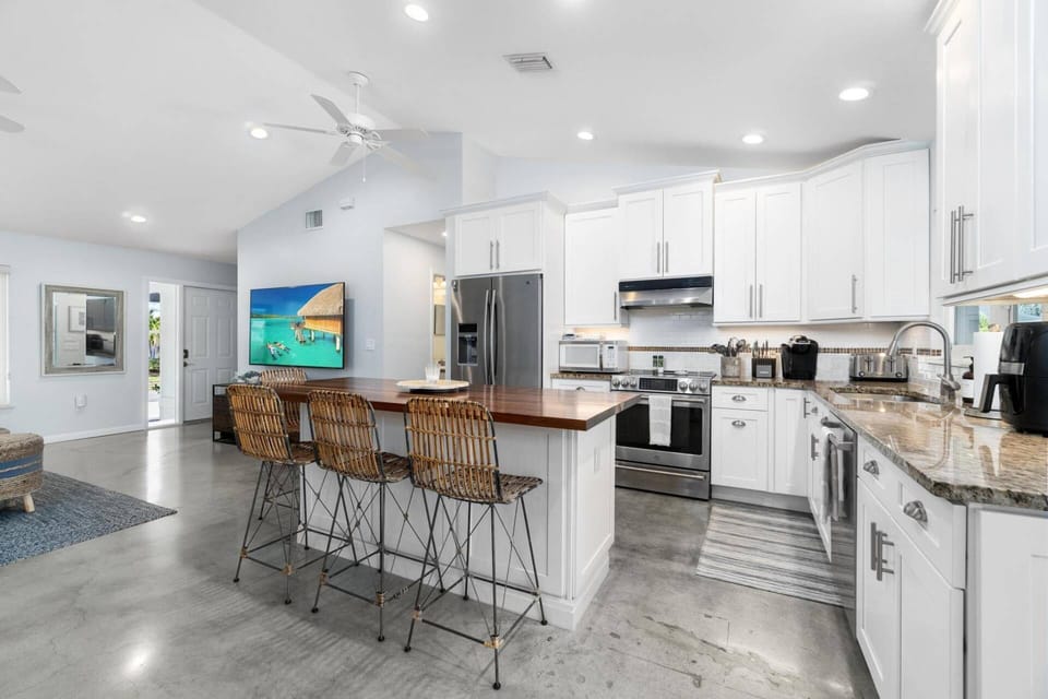 The kitchen is fully equipped and ready for any cooking or cocktailing endeavor.