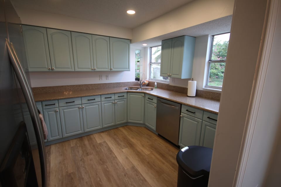 Kitchen with recessed LED can lights and stainless appliances