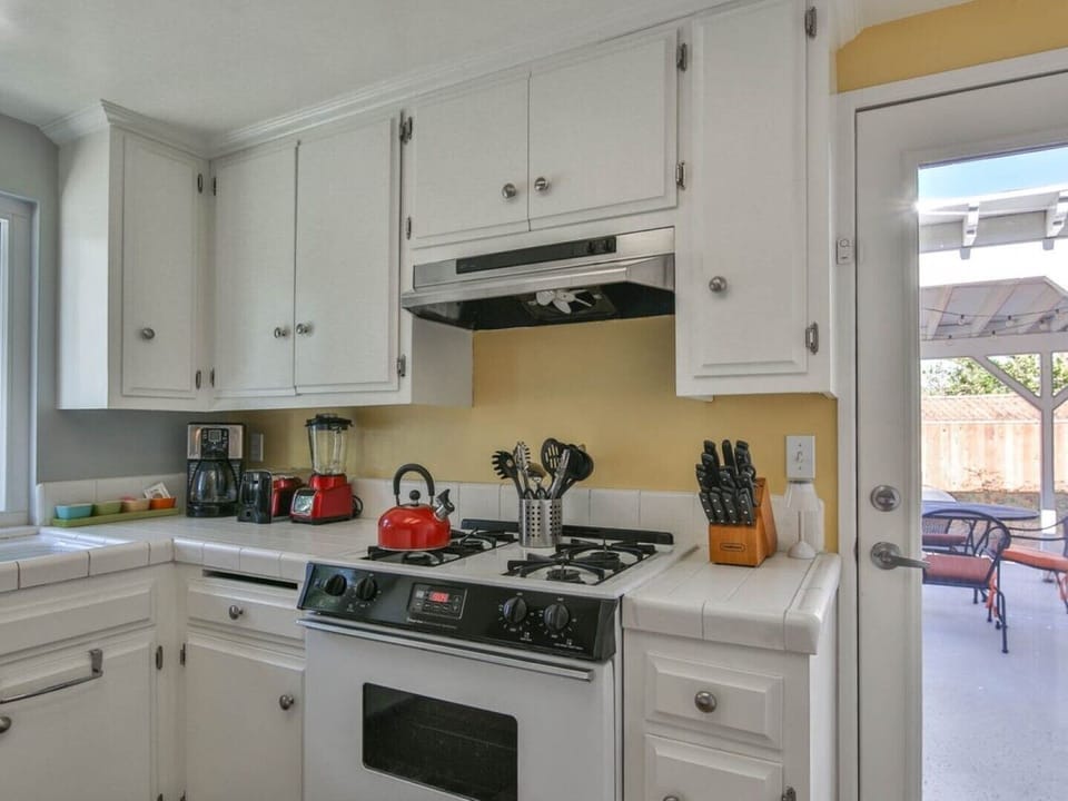 Bright sunny kitchen with counter/bar.