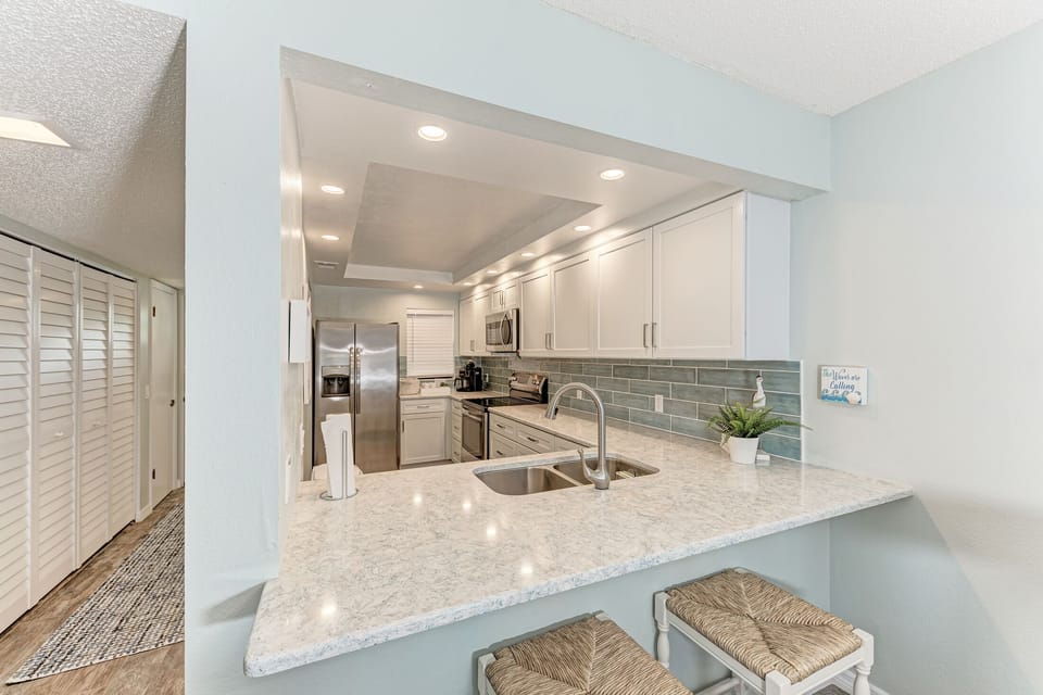 Kitchen island offers additional seating for 2