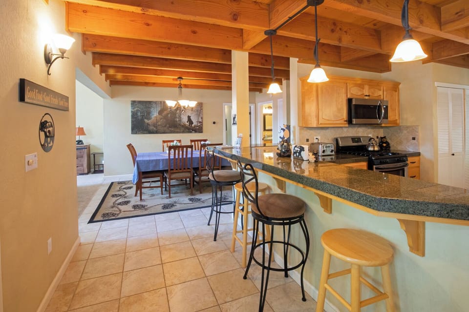 The entryway into the cabin opens to the Full-size kitchen and dining room.