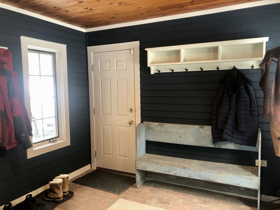 Heated mud room and garage offer plenty of room for skis and equipment.