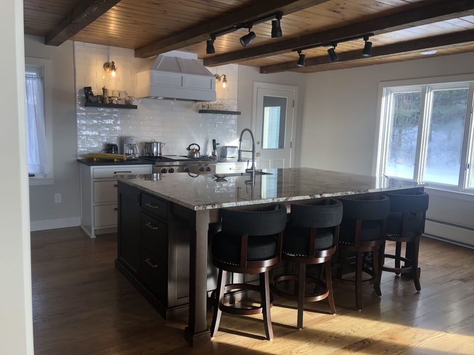 Fully equipped and at your fingertips. 6’ island hang out for guests. Seats 4. 