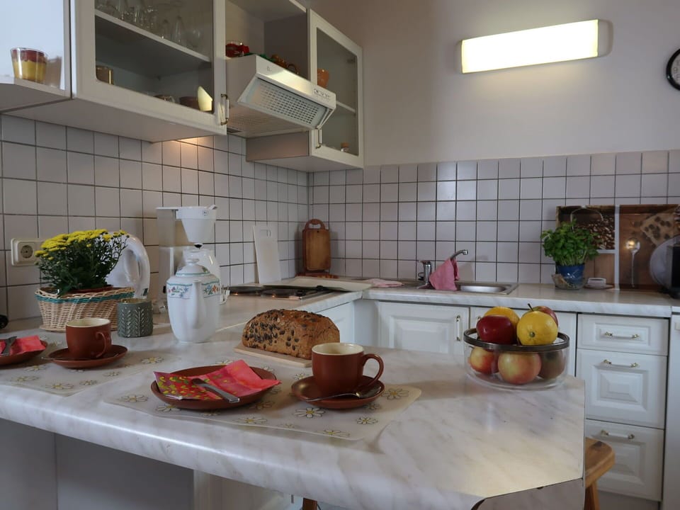 Food, Cabinetry, Countertop, Property, Tableware, Plant, Kitchen Appliance, Kitchen, Kitchen Stove, Interior Design