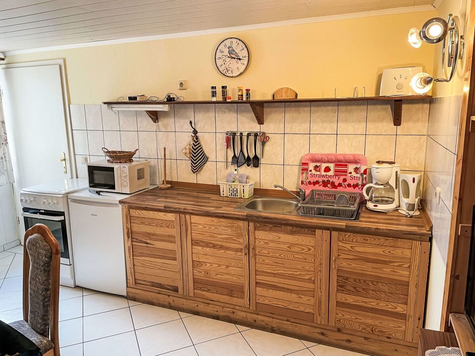 Wood, Furniture, Cabinetry, Flooring, Kitchen, Countertop, Interior Design, Floor, Cupboard, Room