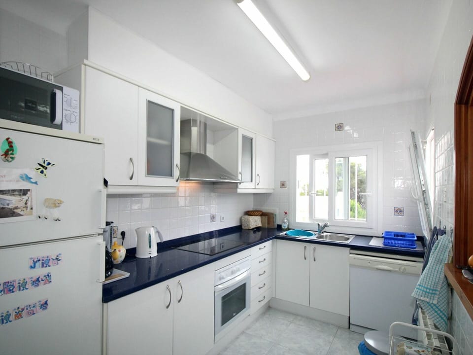 Cabinetry, Property, Countertop, Blue, Sink, Kitchen, Kitchen Appliance, Building, Drawer