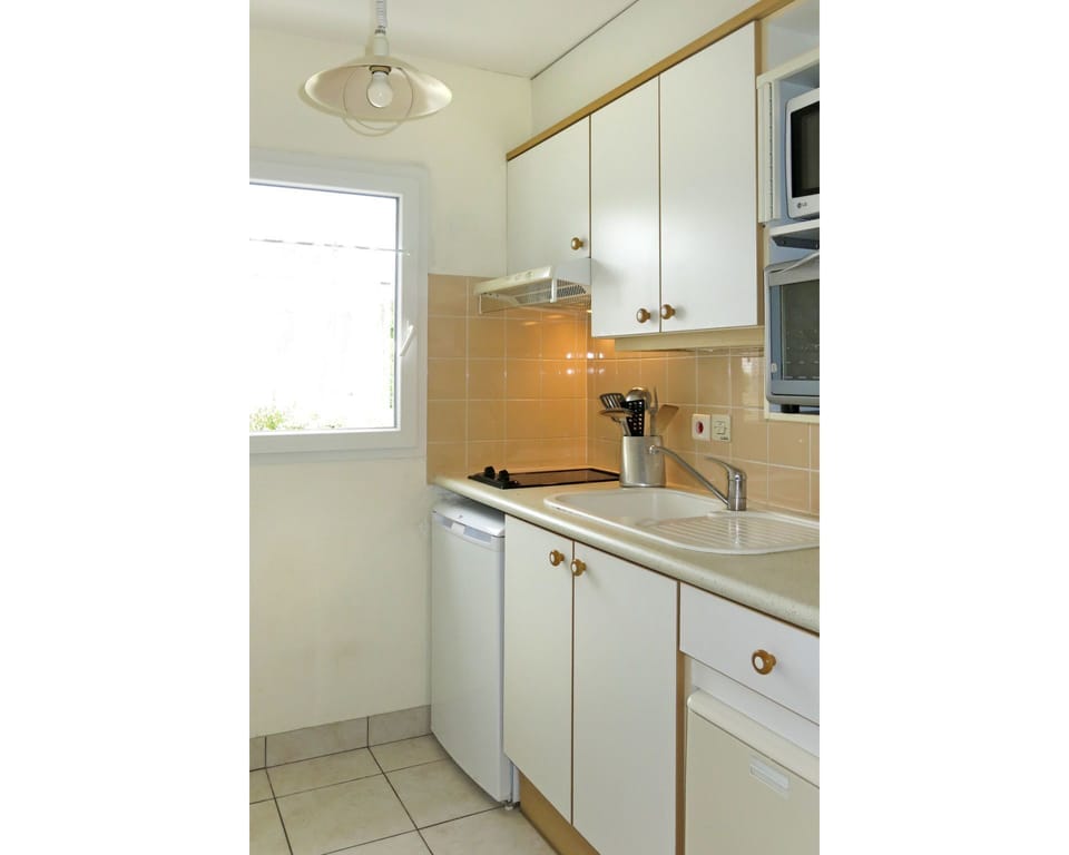 Room, Property, Cabinetry, Kitchen, Furniture, Yellow, Interior Design, Countertop, Sink, Building