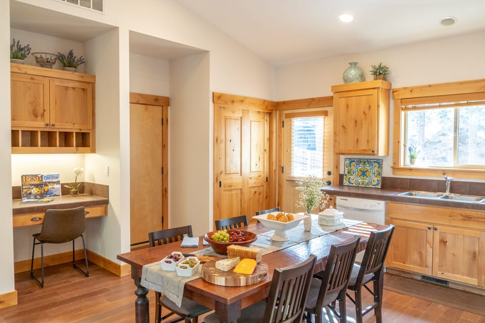 Dining and desk area. Large deck just outside, and access to the garage.