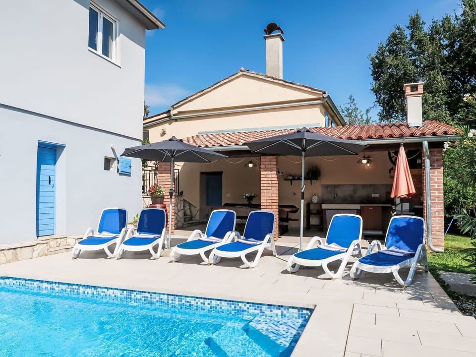 Sky, Furniture, Property, Water, Blue, Building, Azure, Chair, Outdoor Furniture, Swimming Pool