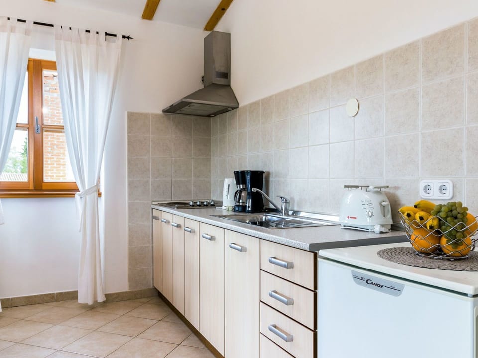 Property, Room, Countertop, Kitchen, Furniture, Cabinetry, Yellow, Interior Design, Building, Tile