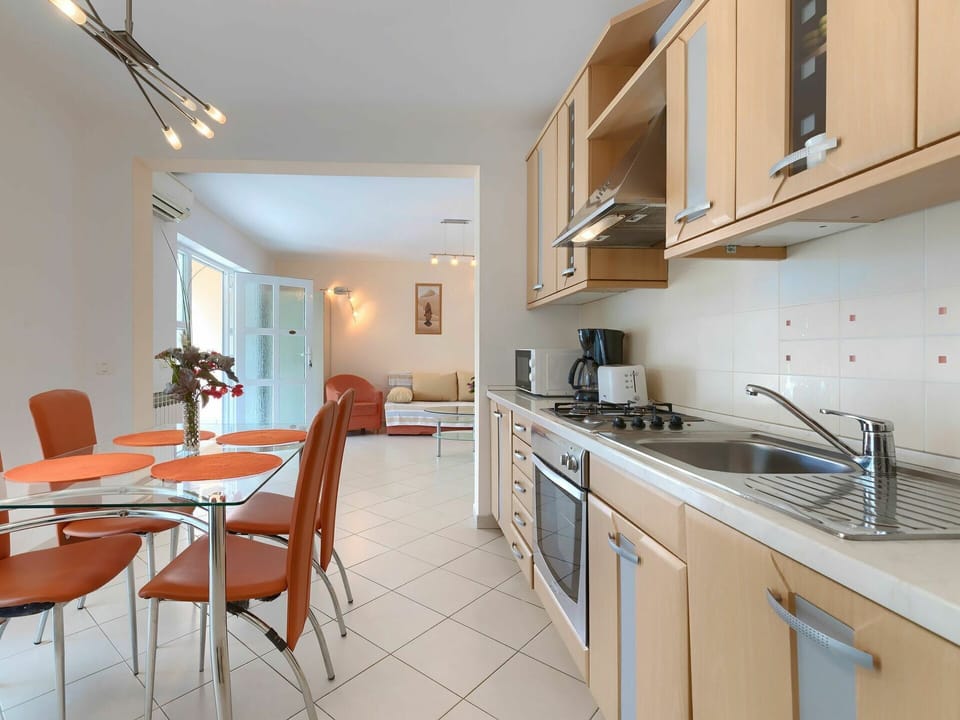 Cabinetry, Furniture, Countertop, Table, Sink, Chair, Kitchen Sink, Kitchen Stove, Kitchen Appliance, Kitchen