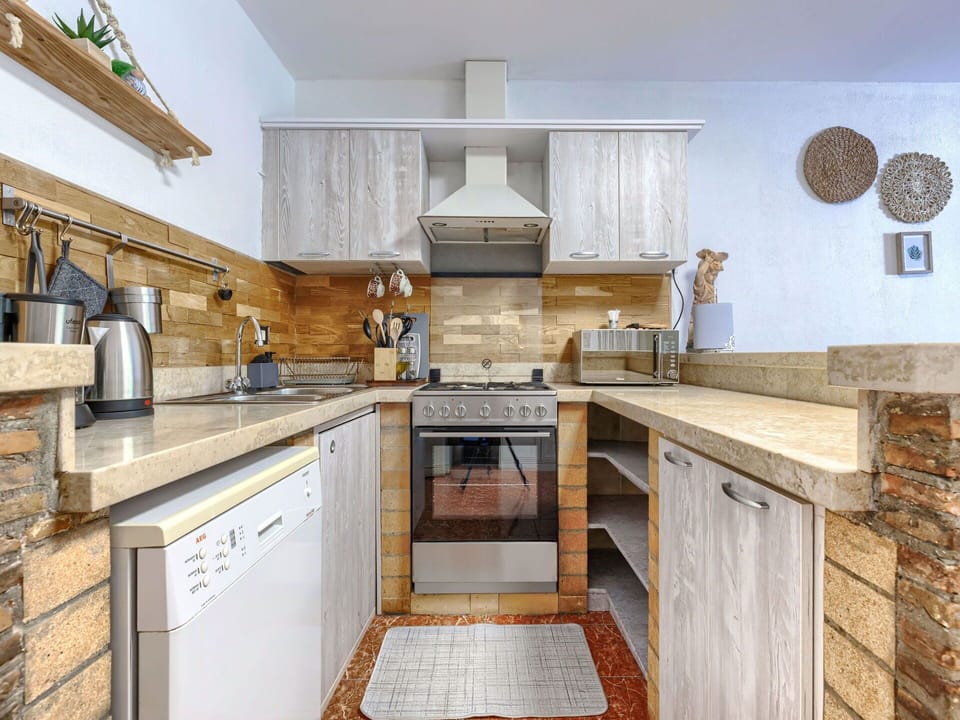 Kitchen, Countertop, Kitchen Appliance, Cabinetry, Major Appliance, Flooring, Interior Design, Furniture, Wood, Home Appliance