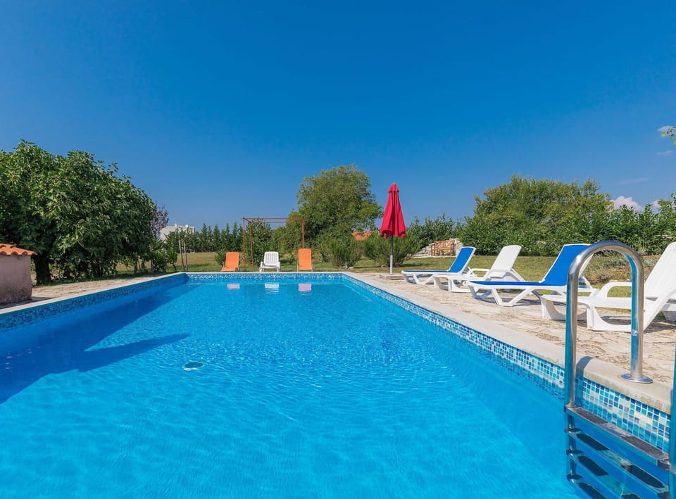 Water, Sky, Property, Swimming Pool, Building, Azure, Blue, Tree, Chair, Body Of Water
