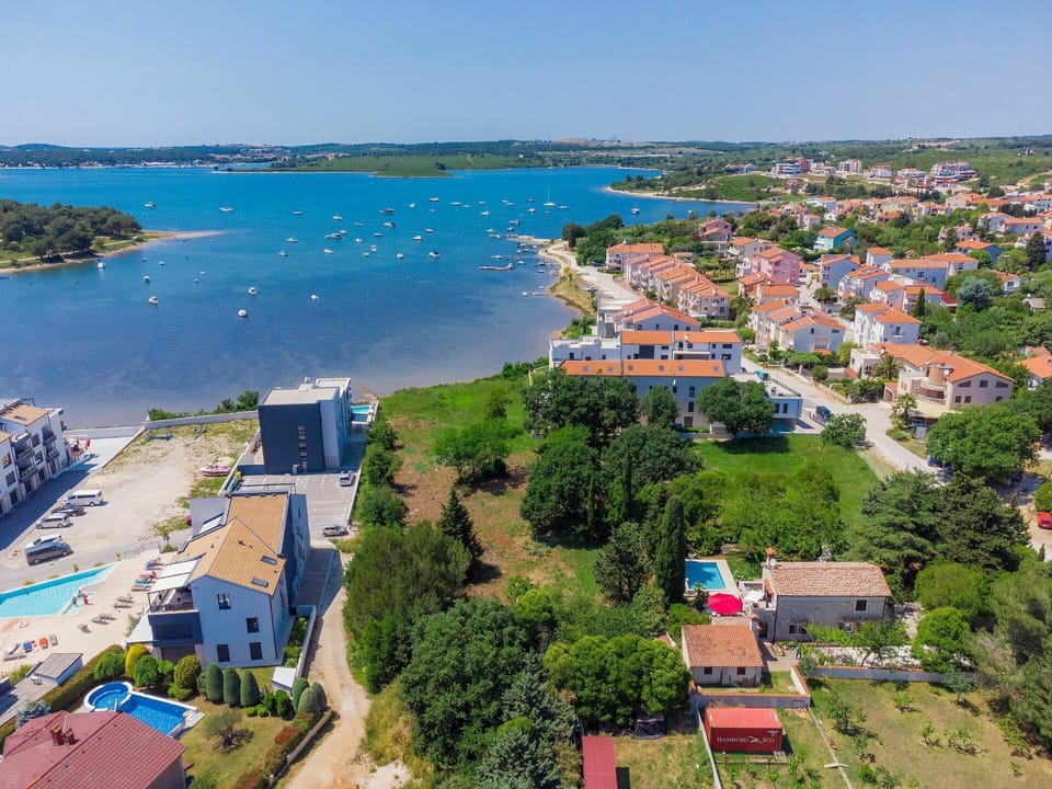 Water, Sky, Property, Building, Nature, Azure, Coastal And Oceanic Landforms, Urban Design, Tree