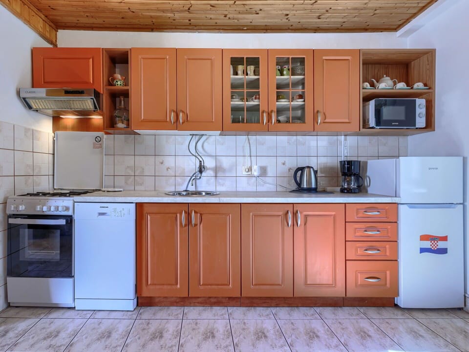 Kitchen, Countertop, Cabinetry, Wood, Furniture, Kitchen Appliance, Kitchen Sink, Interior Design, Major Appliance, Flooring
