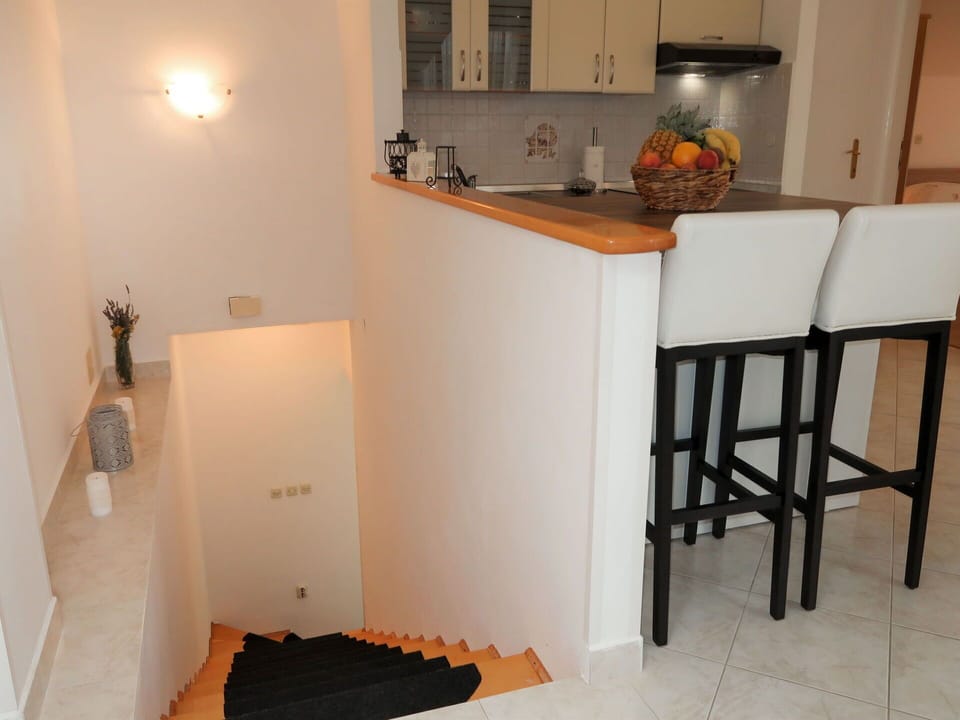 Property, Wood, Table, Lighting, Flooring, Interior Design, Cabinetry, Floor, Wood Stain, Hardwood