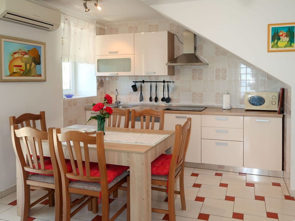 Cabinetry, Furniture, Property, Table, Countertop, Chair, Wood, Lighting, Interior Design, Kitchen & Dining Room Table