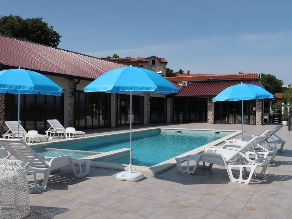 Water, Sky, Property, Swimming Pool, Azure, Umbrella, Shade, Outdoor Furniture, Chair, Sunlounger