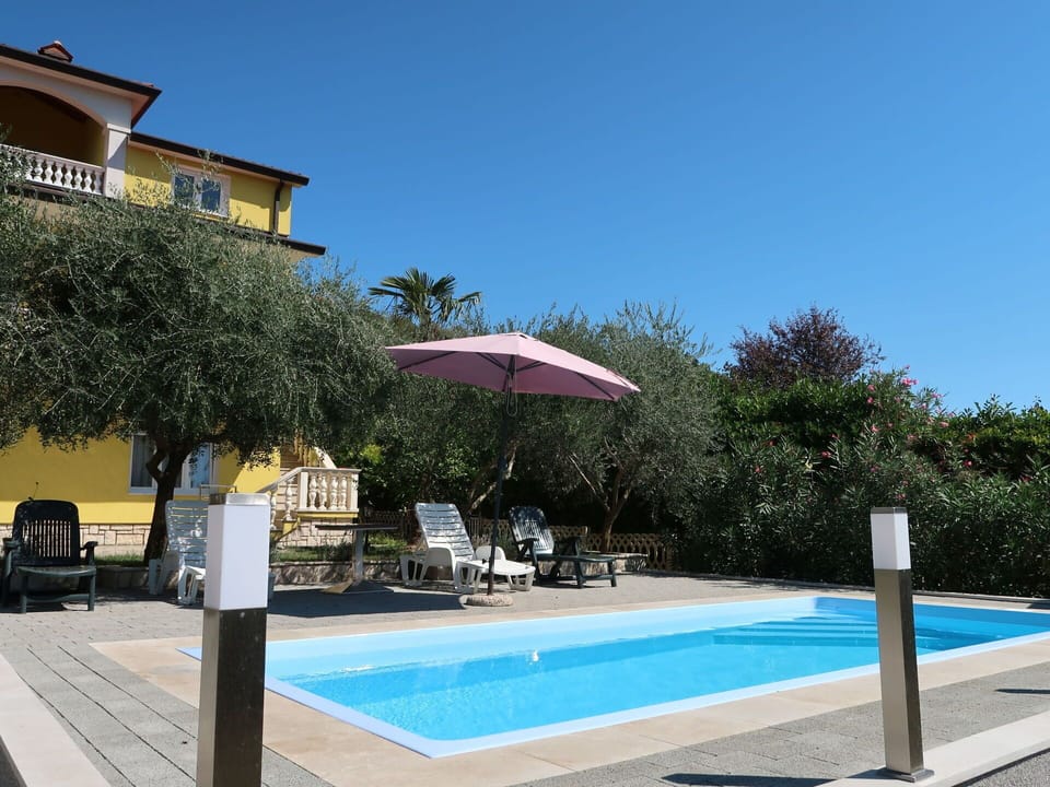 Sky, Water, Property, Building, Plant, Azure, Shade, Swimming Pool, Tree, Outdoor Furniture