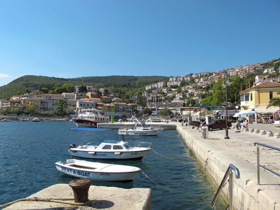 Water, Sky, Boat, Watercraft, Building, Vehicle, Azure, Mountain, Coastal And Oceanic Landforms, Body Of Water
