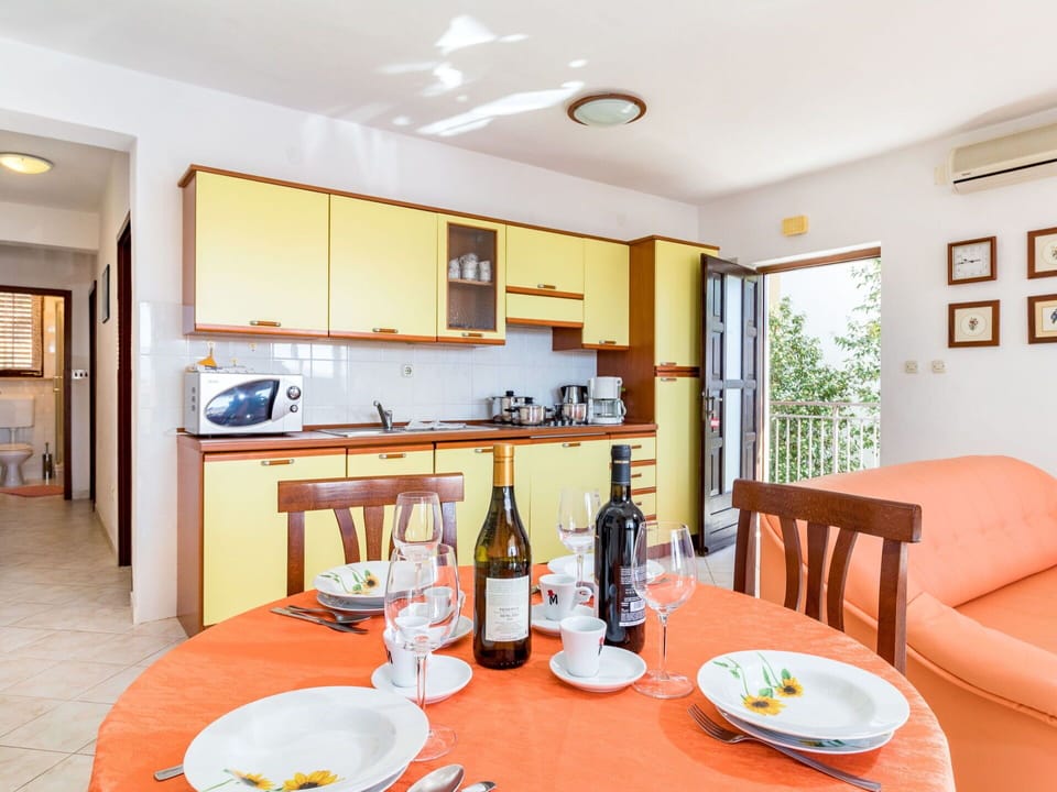 Food, Table, Property, Bottle, Cabinetry, Furniture, Tableware, Countertop, Dishware, Wood