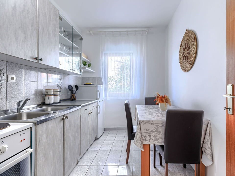 Furniture, Kitchen, Countertop, Kitchen Appliance, Interior Design, Major Appliance, Flooring, Kitchen Sink, Lighting, Floor