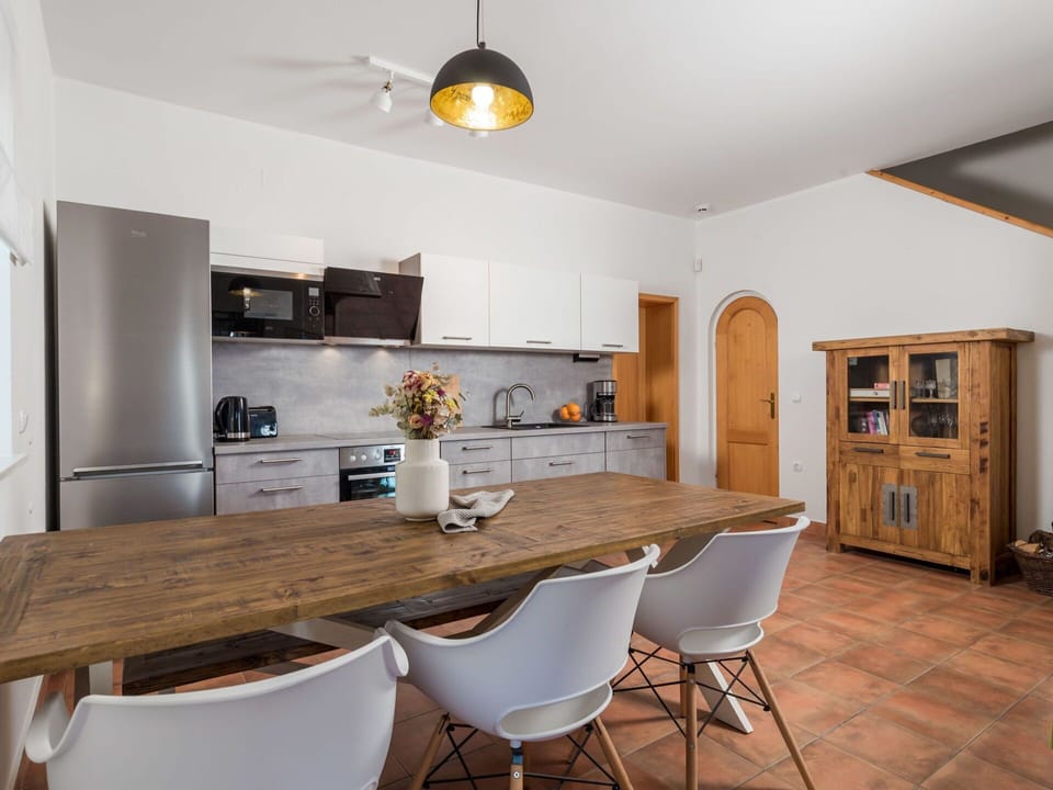 Furniture, Property, Cabinetry, Countertop, Table, Wood, Chair, Lighting, Picture Frame, Interior Design