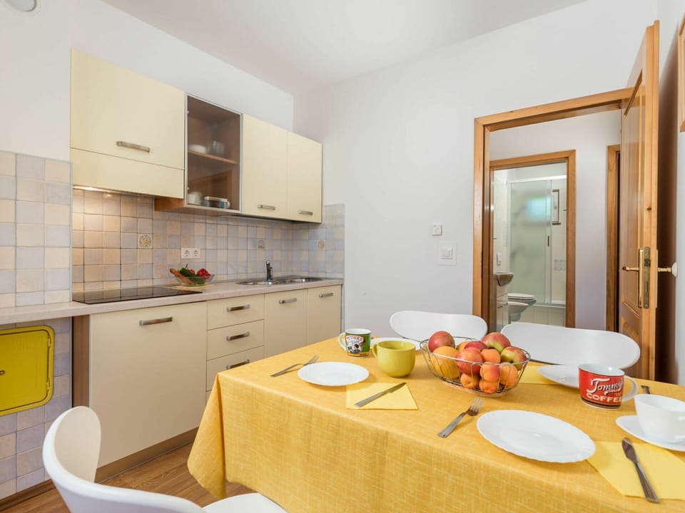 Cabinetry, Property, Furniture, Table, Countertop, Orange, Shelf, Interior Design, Sink, Building