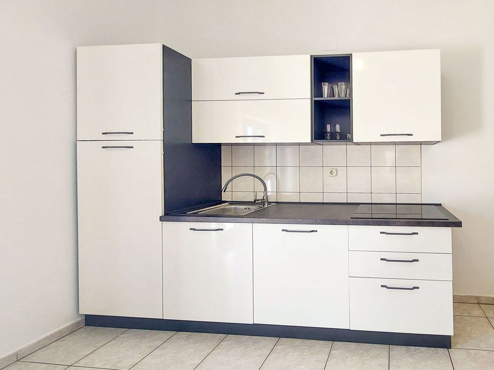 Cabinetry, Flooring, Cupboard, Interior Design, Floor, Drawer, Furniture, Countertop, Home, Kitchen