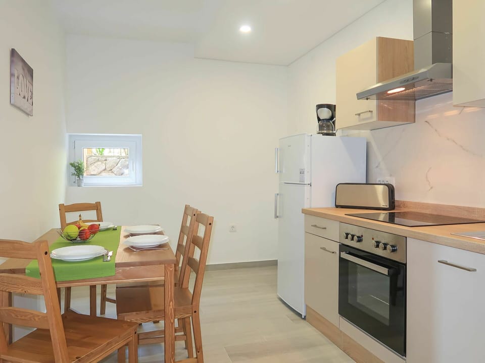 Furniture, Cabinetry, Property, Picture Frame, Kitchen Stove, Countertop, Kitchen Appliance, Chair, Table, Wood