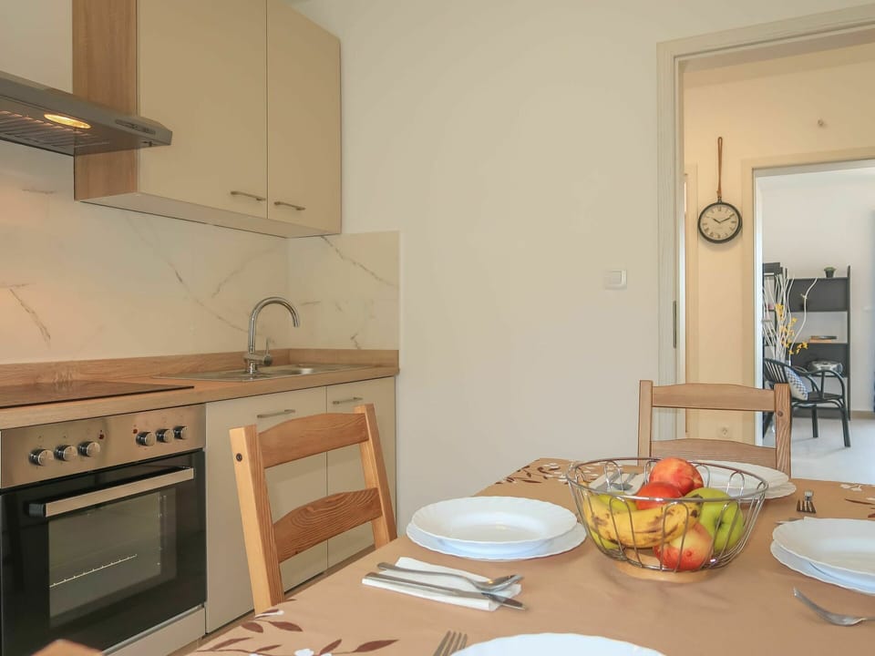 Food, Tableware, Cabinetry, Table, Furniture, Countertop, Kitchen, Dishware, Building, Kitchen Stove