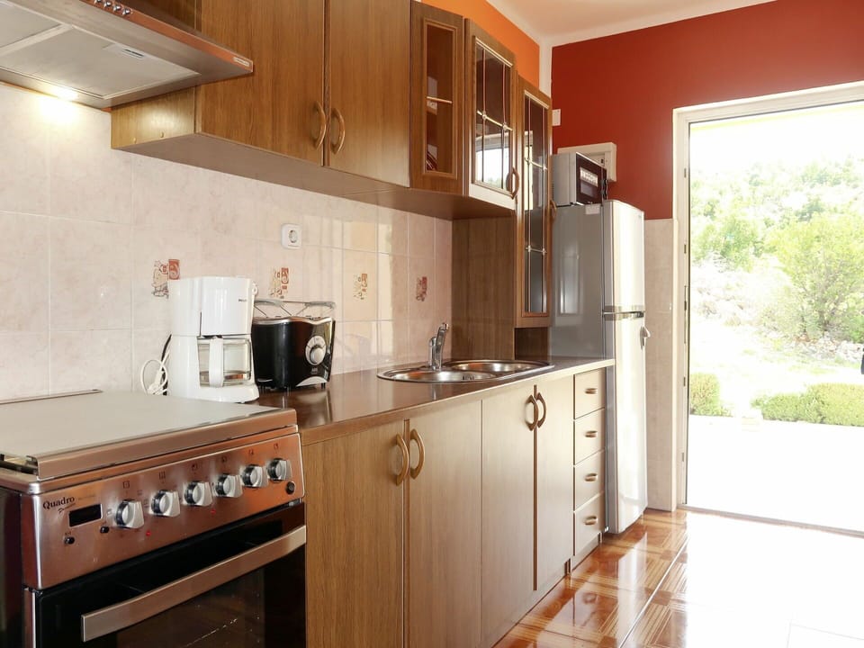 Cabinetry, Countertop, Building, Kitchen, Wood, Kitchen Appliance, Kitchen Stove, Interior Design, Plant, Flooring