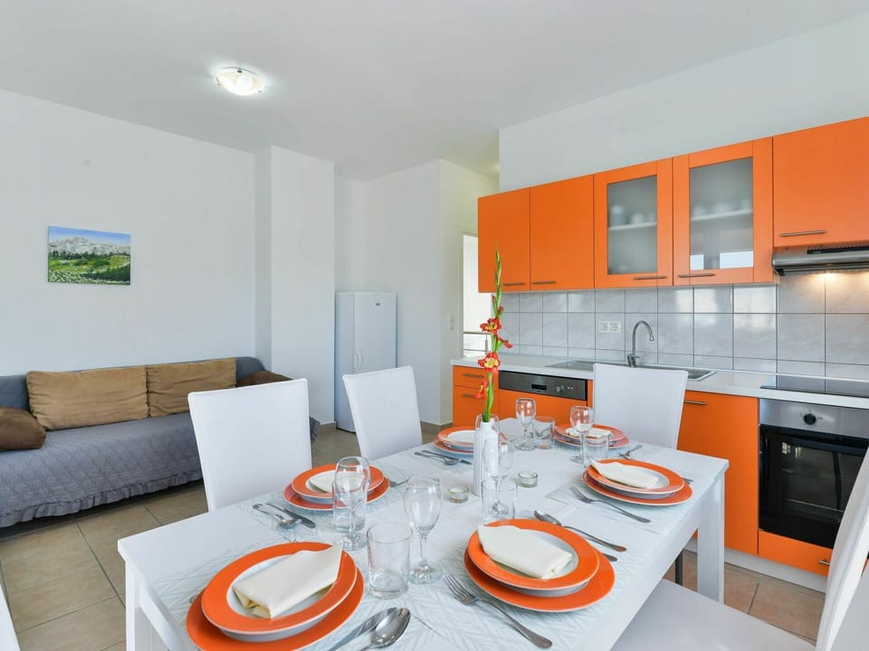 Cabinetry, Furniture, Property, Table, Countertop, Orange, Kitchen Stove, Interior Design, Lighting, Architecture