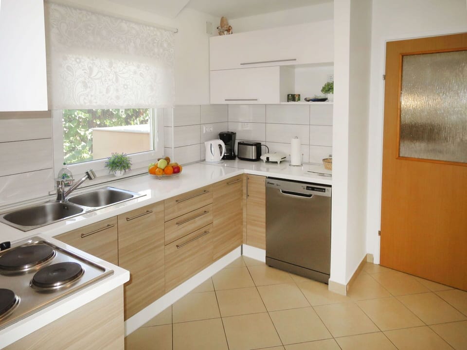 Kitchen Sink, Sink, Cabinetry, Tap, Countertop, Furniture, Plumbing Fixture, Kitchen Stove, Plant, Kitchen