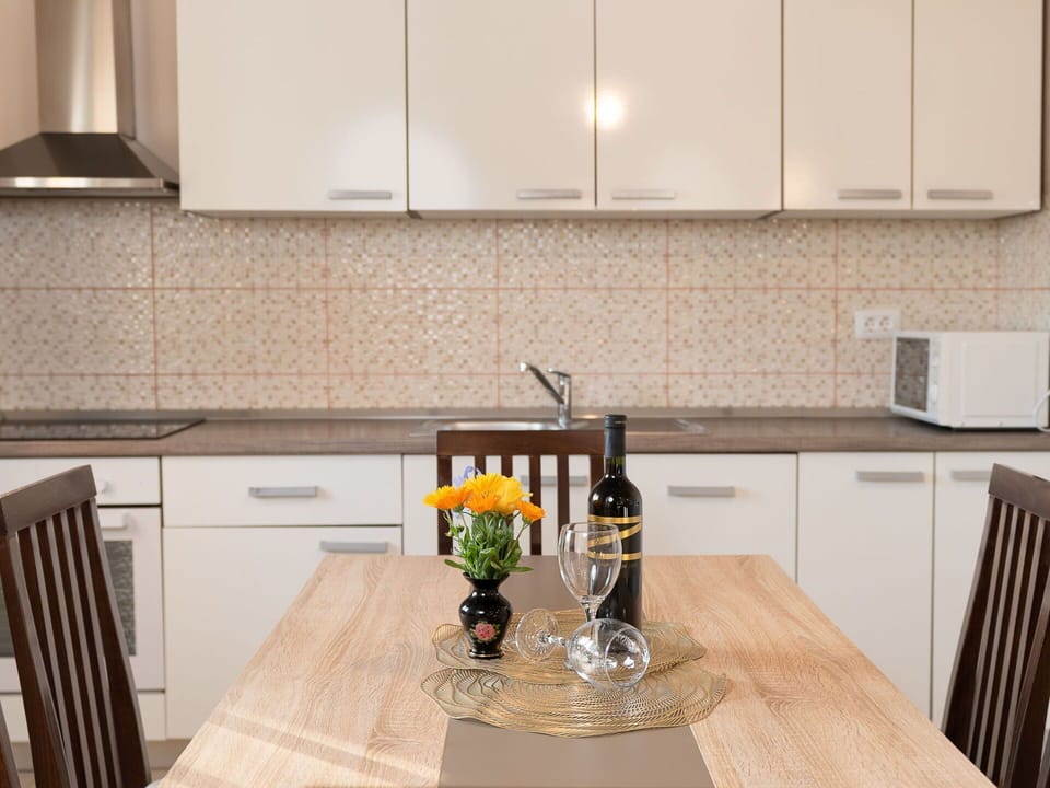 Kitchen, Countertop, Cabinetry, Kitchen Appliance, Furniture, Interior Design, Wood, Flooring, Major Appliance, Sink