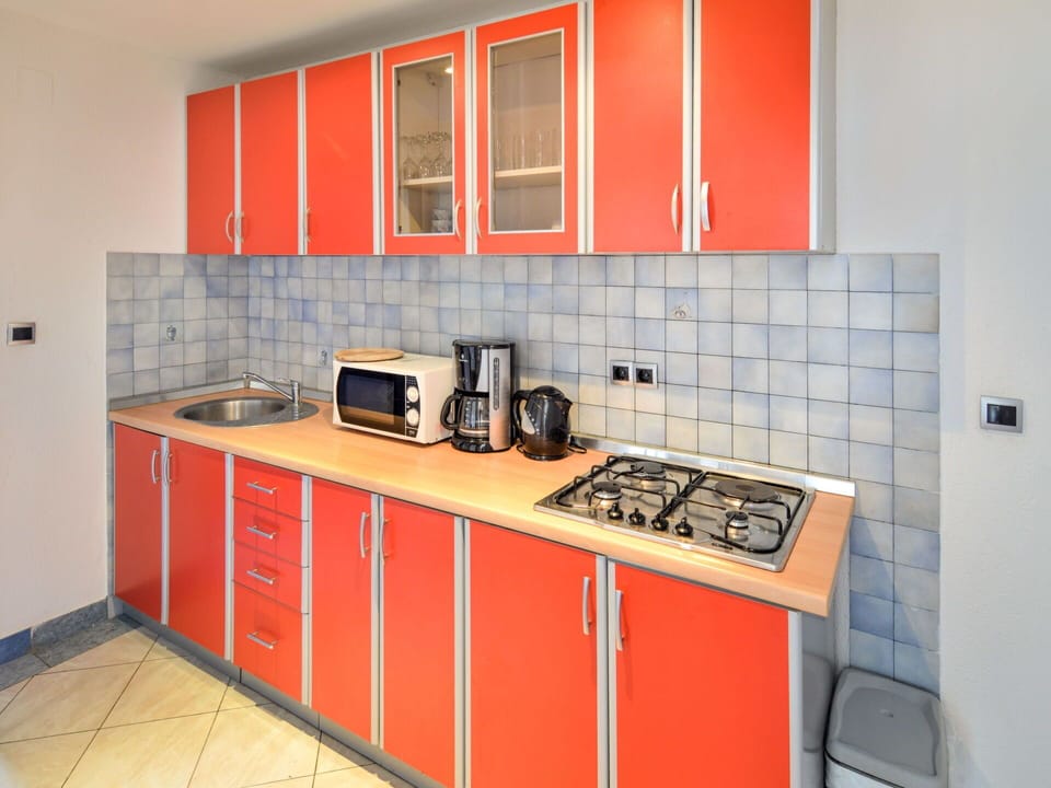 Cabinetry, Countertop, Kitchen Appliance, Kitchen Stove, Kitchen Sink, Gas Stove, Kitchen, Home Appliance, Cooktop, Stove