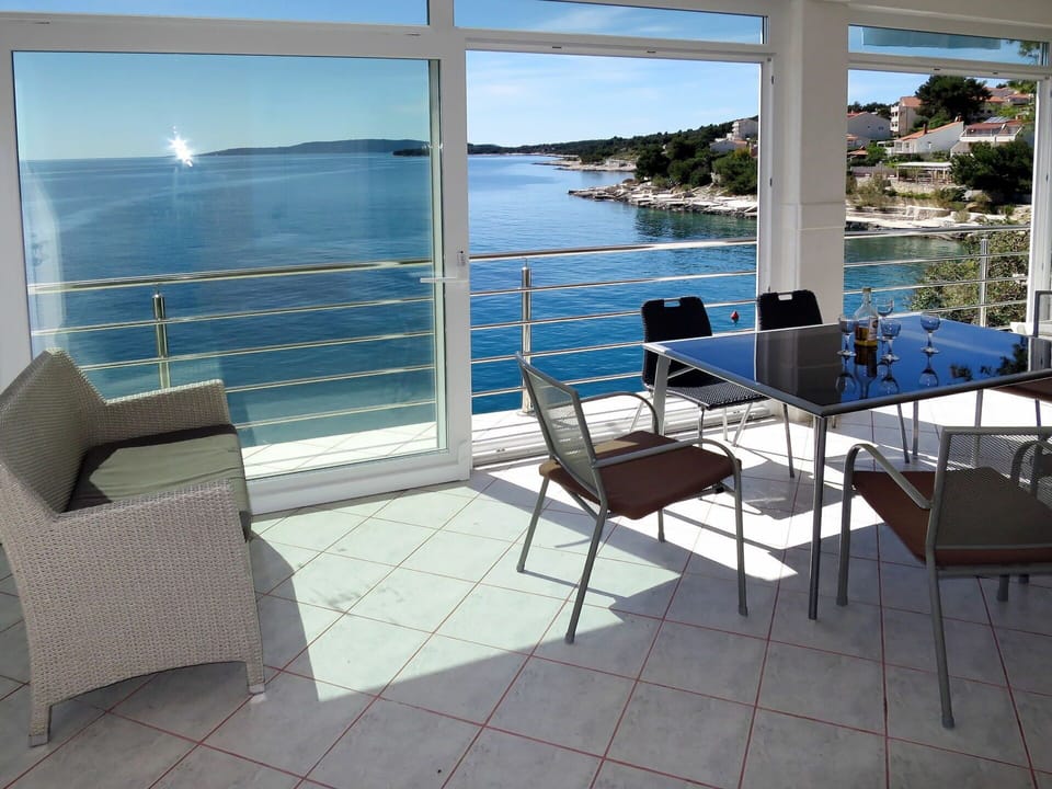 Water, Furniture, Sky, Property, Building, Blue, Chair, Shade, Outdoor Furniture, Interior Design