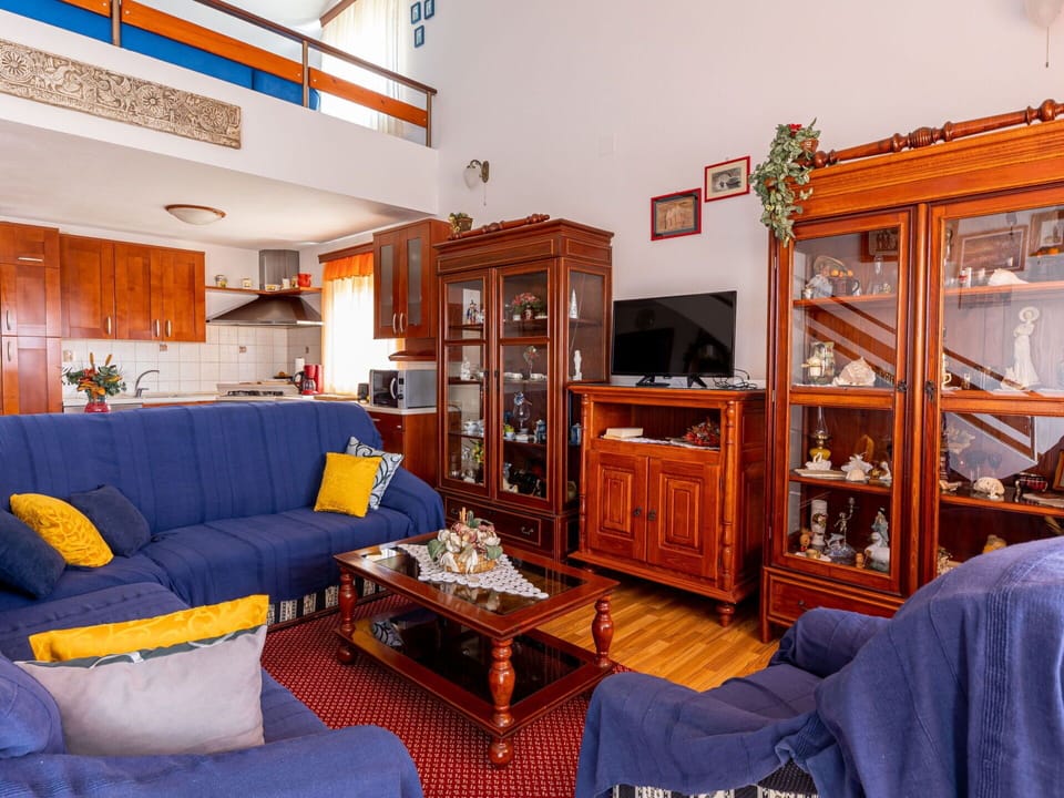 Furniture, Picture Frame, Couch, Living Room, Orange, Interior Design, Shelf, Bookcase, Table, Comfort