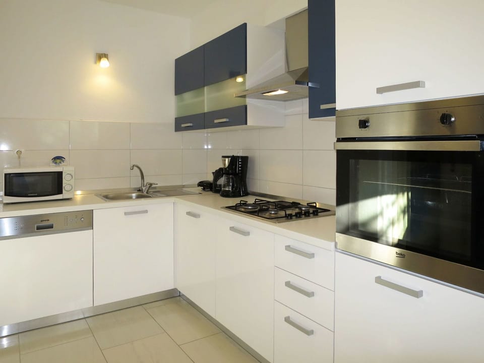 Cabinetry, Countertop, Kitchen Sink, Tap, Sink, Kitchen Stove, Cooktop, Kitchen Appliance, Gas Stove, Stove