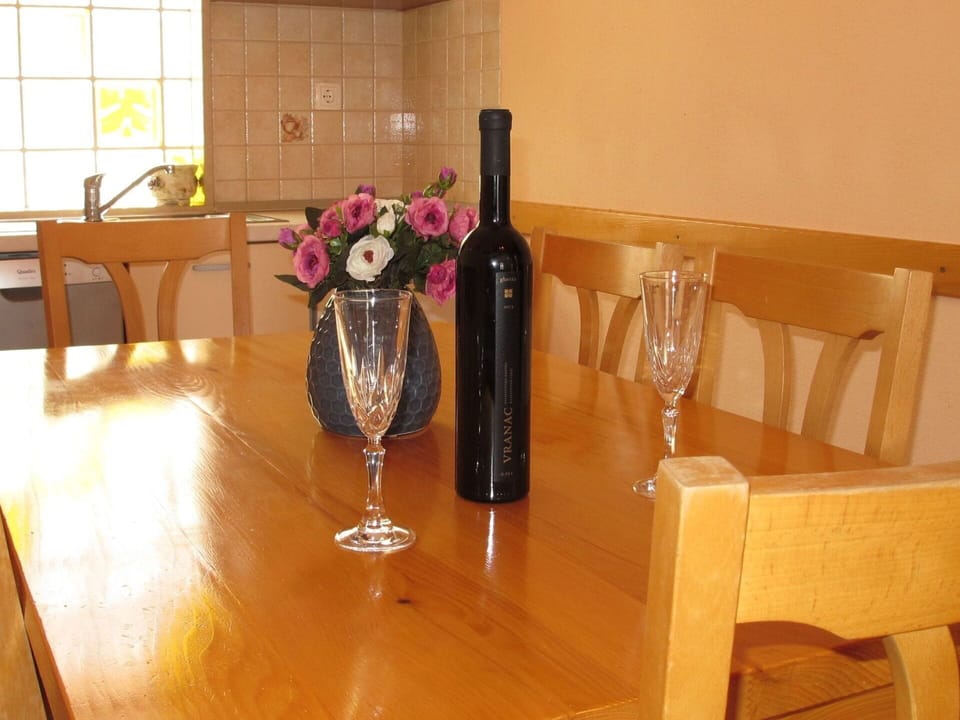 Flower, Tableware, Table, Furniture, Bottle, Stemware, Drinkware, Plant, Window, Vase