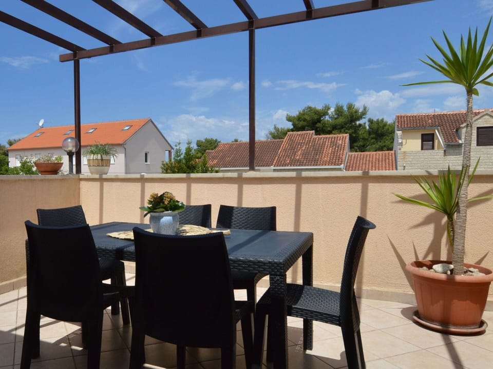 Sky, Furniture, Plant, Cloud, Table, Property, Chair, Building, Shade, Houseplant