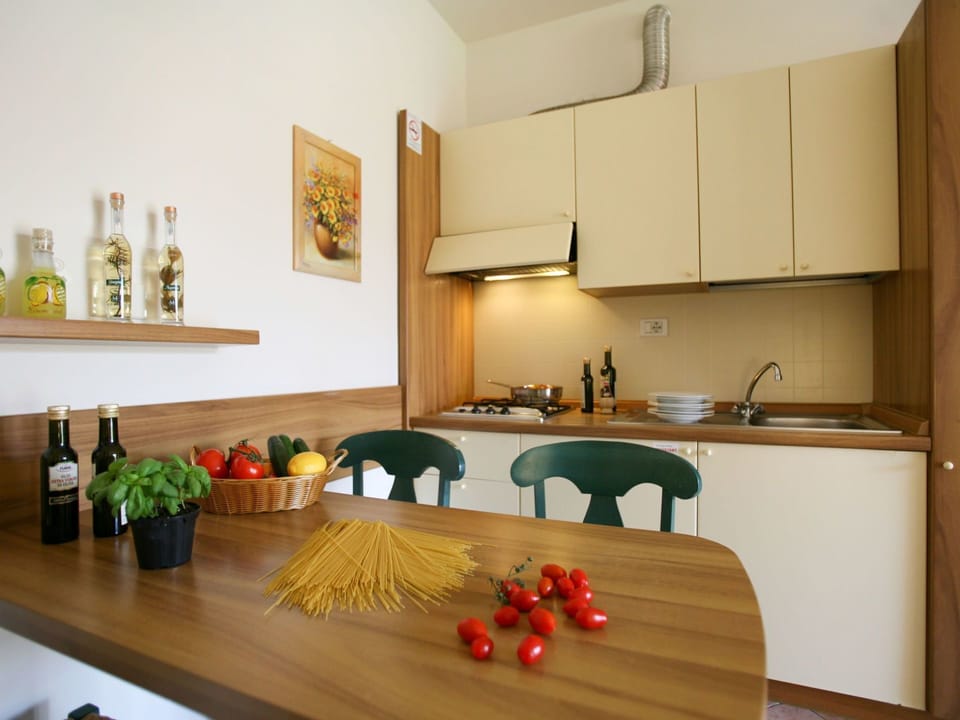Table, Furniture, Cabinetry, Countertop, Sink, Wood, Orange, Interior Design, Picture Frame, Kitchen