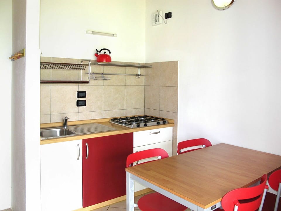 Cabinetry, Furniture, Property, Countertop, Kitchen Stove, Kitchen Appliance, Sink, Building, Wood, Interior Design