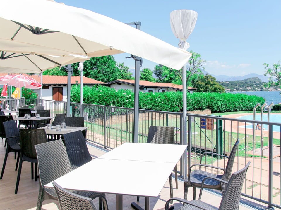 Table, Plant, Furniture, Sky, Property, Chair, Green, Shade, Outdoor Furniture, Building
