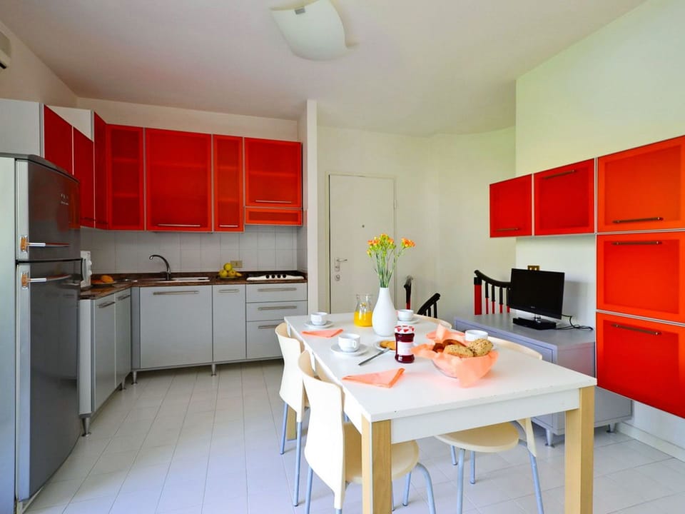 Room, Furniture, Kitchen, Property, Countertop, Interior Design, Cabinetry, Kitchen Stove, Building, Red