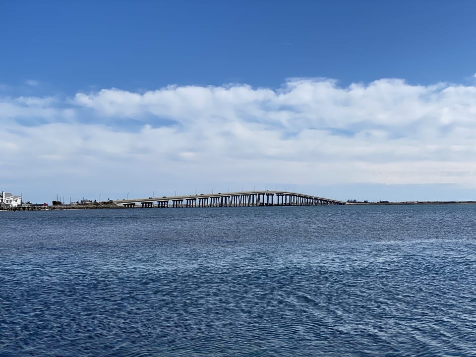 View of Ponquogue Bridge from bay beach near house 