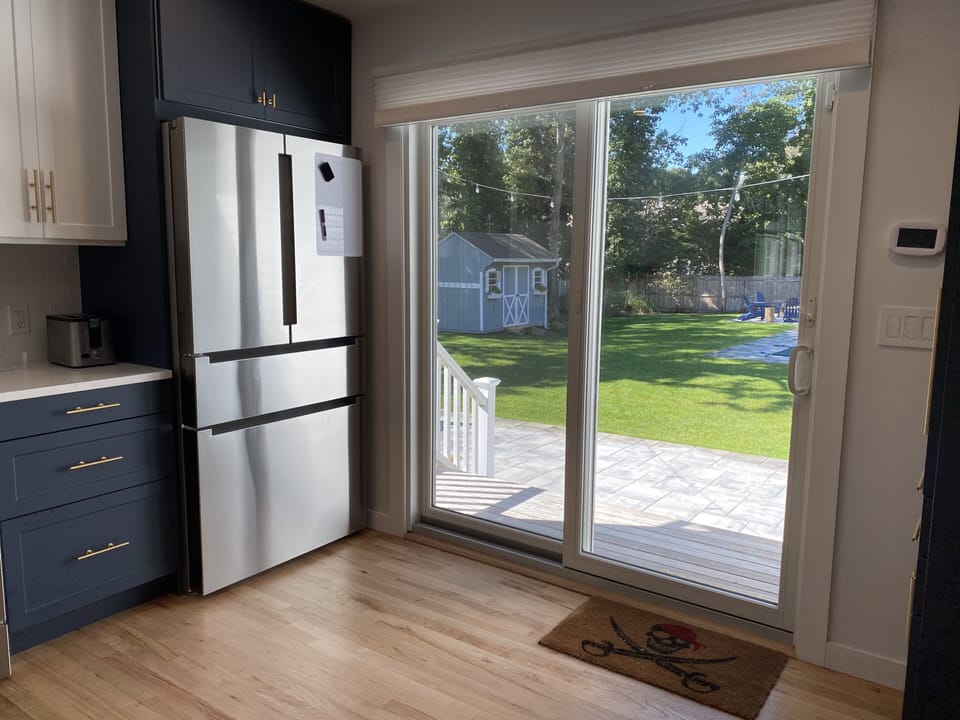 Kitchen connects directly to rear patio. 