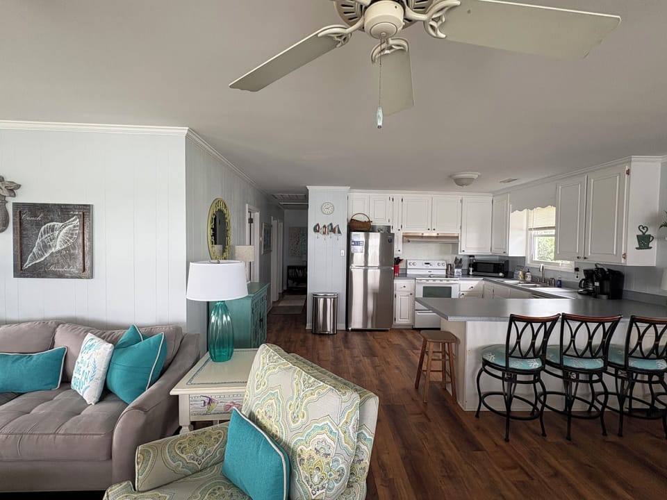 Airy, open layout allows water views from throughout the front of cottage.